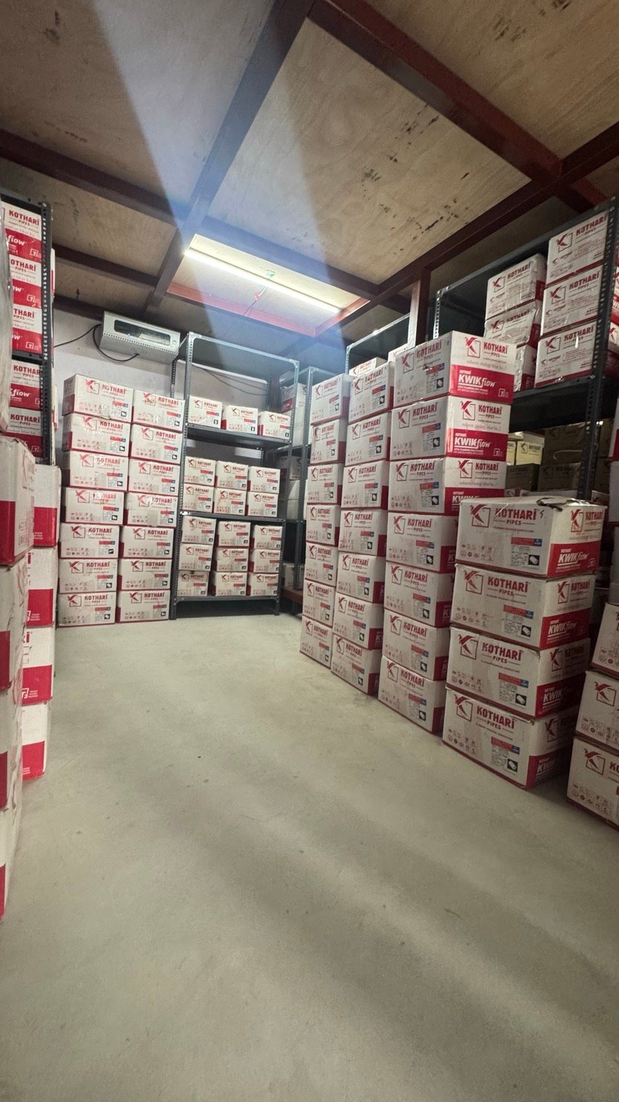 Aisle stacked floor-to-ceiling with Kothari KwikFlow boxes